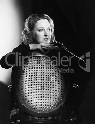 Portrait of woman on chair