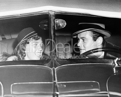 Happy couple in antique car