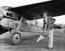 Woman in suit with plane