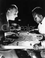 Two men playing backgammon
