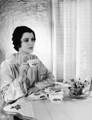 Woman having meal at table