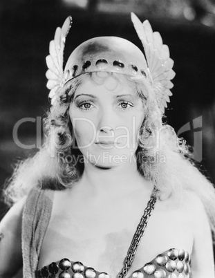 Young woman wears her cap with wings