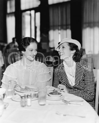 Two women sitting together in a restaurant