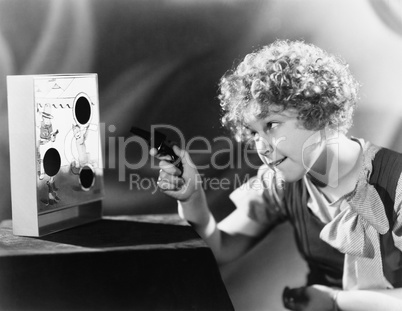 Girl playing with a gun