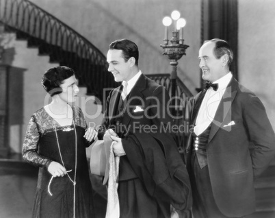 Young man greeting a woman