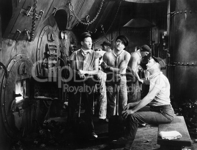 Men together in a ship's boiler room