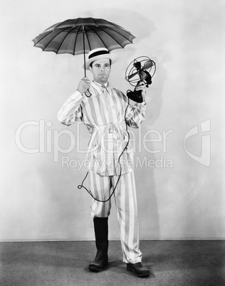 The weather man with umbrella, boot and fan