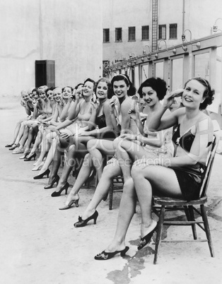 Group of women sitting together on chairs