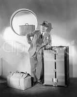 Man standing and waiting with his luggage
