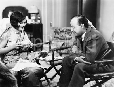 Couple sitting together having tea