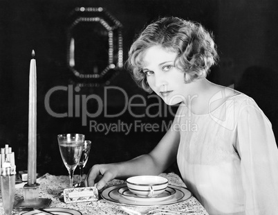 Woman sitting at the dinner table