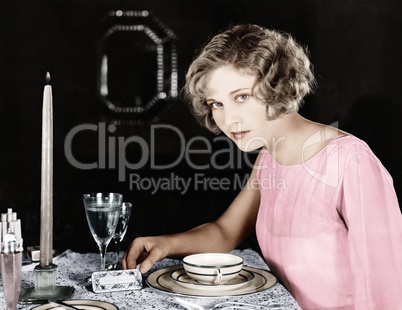 Woman sitting at the dinner table