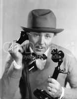 Man in a hat talking on the telephone