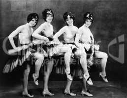 Portrait of four young women performing a dance