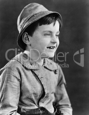 Portrait of a boy in a hat and grinning