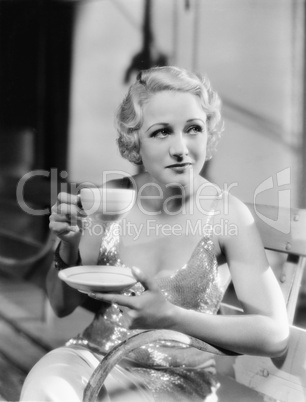 Young woman holding a cup of tea