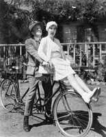 Couple sitting on a tandem bicycle
