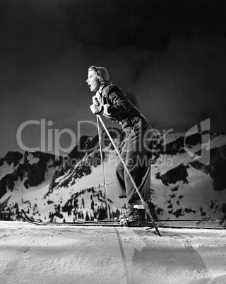 Profile of a young woman skiing