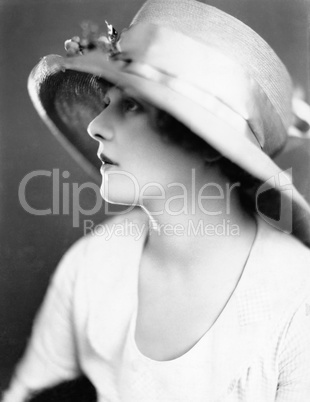 Portrait of a young woman wearing a hat