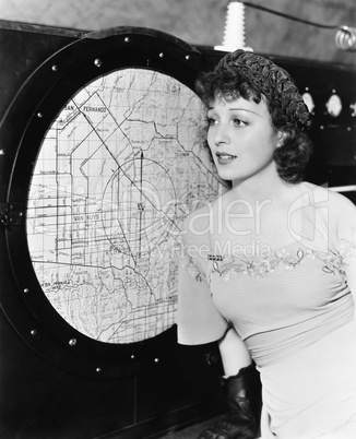 Young woman looking at a radar