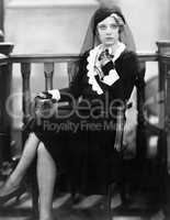 Young woman sitting in a courtroom