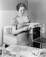 Woman preparing a pie in the kitchen