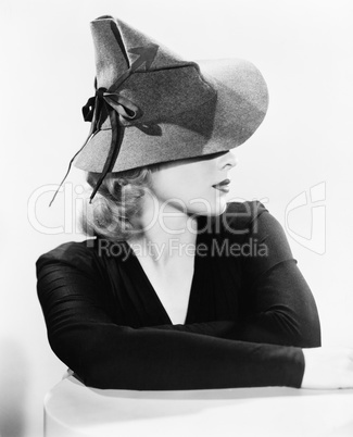 Portrait of a young woman wearing a hat