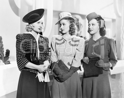Three women standing side by side
