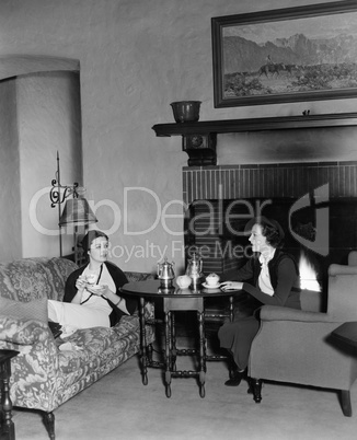 Two women drinking tea and talking