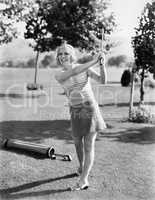 Woman playing golf on a golf course