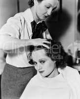 Young woman getting her hair done in a hair salon