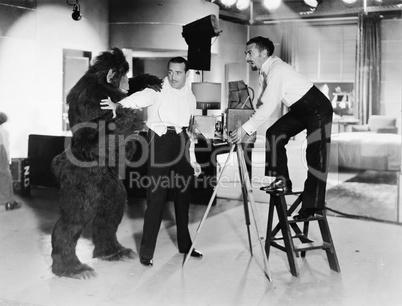 Two young men looking feared being attacked by a gorilla