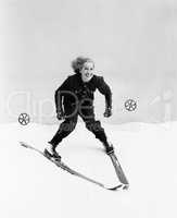 Female skier skiing downhill