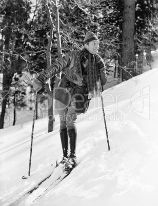 Male skier skiing downhill