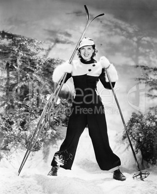 Portrait of a young woman skiing and smiling