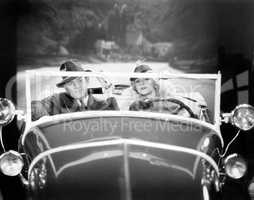 Couple driving a car