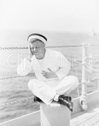 Sailor suffering from stomachache on the ship