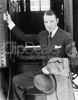 Portrait of a businessman boarding a train