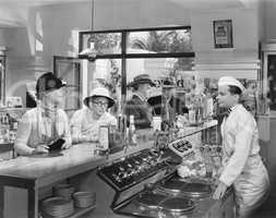 People at a soda fountain