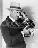 Profile of a man talking on the telephone