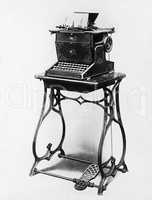 Picture of a typewriter on a stand