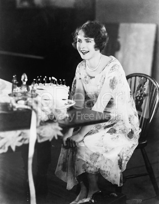 Profile of a young woman celebrating her birthday