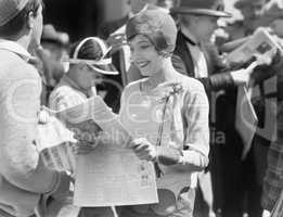 Elegant woman reading a newspaper