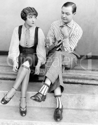 Couple sitting together on steps