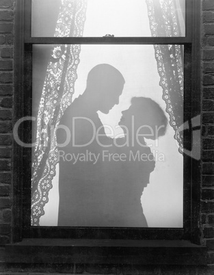 Silhouette of a couple embracing