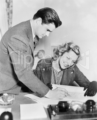 Couple reading a document together