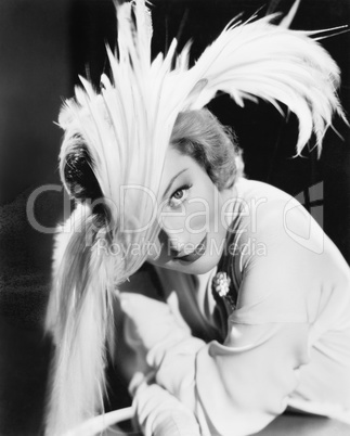 Woman in a dramatic feather hat