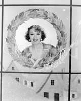 Image of a woman in a holiday wreath