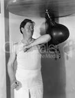 Athlete working out with a punching bag