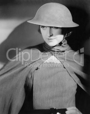 Woman in an army helmet and uniform